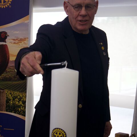 Gordon lighting the peace candle 